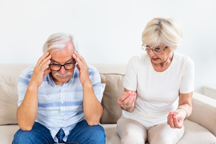 Older adults discussing dizziness concerns at home